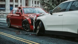 Head-on collision between two cars. A car accident lawyer can determine how to dispute fault in the car accident after investigating the accident scene.