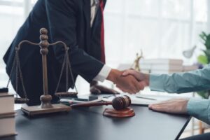 Lawyer meets with a client who was injured in a car accident when backing up.