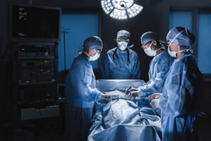 Surgeons in an operating room with a slip and fall patient