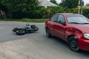 A damaged motorcycle lies on its side after a crash in New York. Motorcycle accidents can cause a wide range of injuries, from broken bones and road rash to traumatic brain and spinal cord injuries.